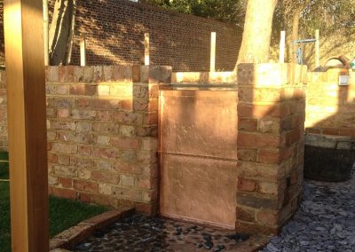 Copper wall of water from pond. family garden brigthon