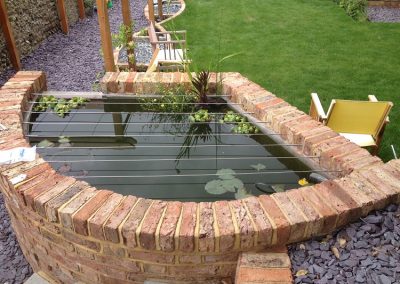 Reclaimed Victorian brick pond. Family garden brighton